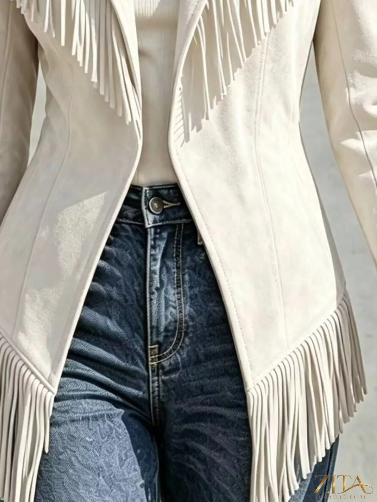 Western-inspired fringed open front jacket from Trendsi, showcasing tan fabric with fringe details and a relaxed fit.