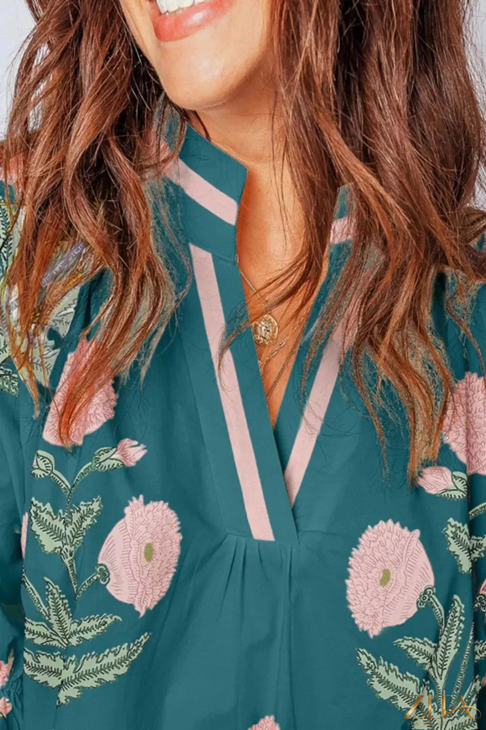 Floral embroidered notched blouse by Zita La Belle Elite, featuring delicate floral embroidery and a stylish notched neckline.