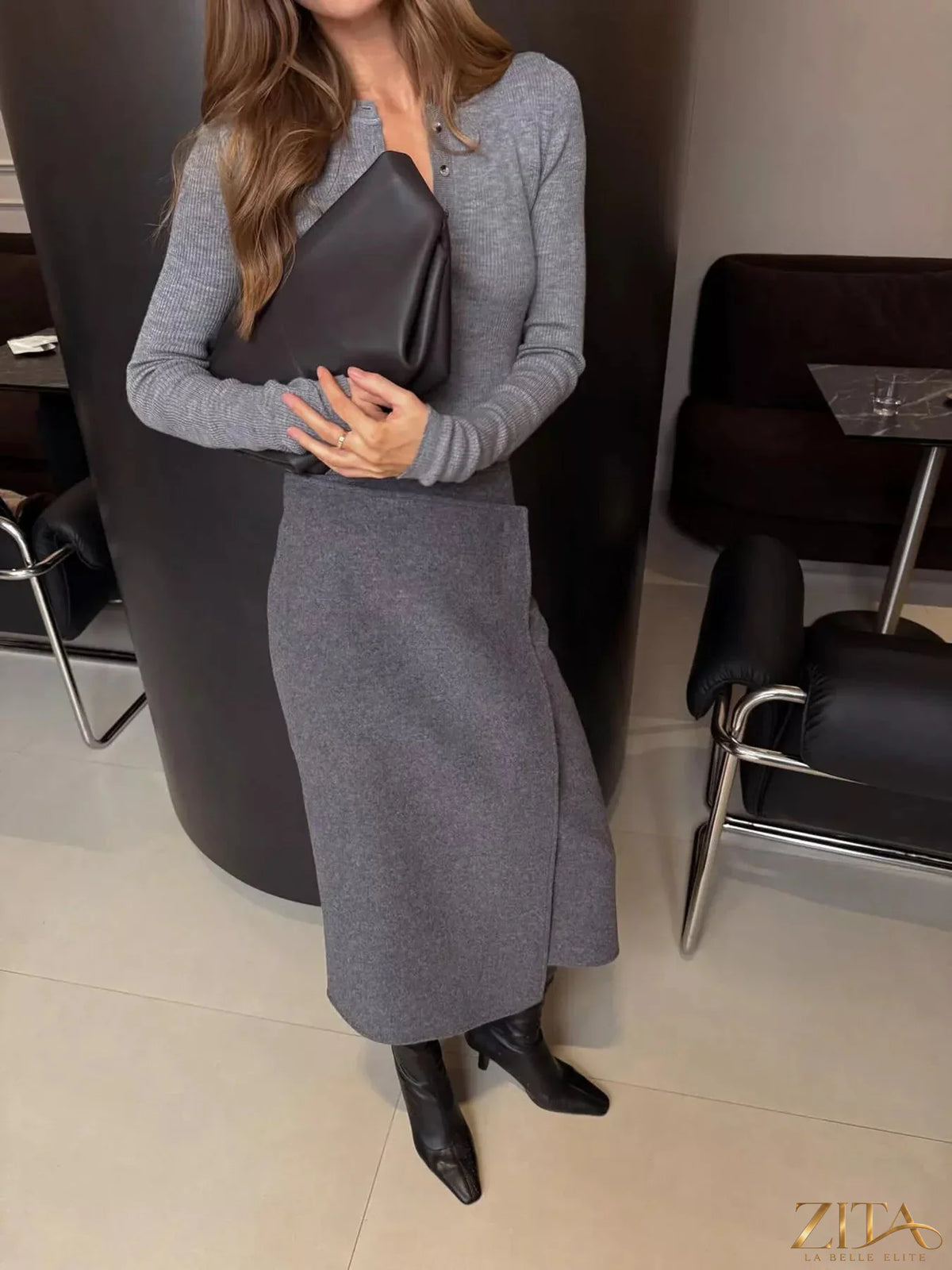 High-waisted wrap midi skirt by Trendsi, featuring a stylish design with a tied waist and flowing fabric, shown in the image.