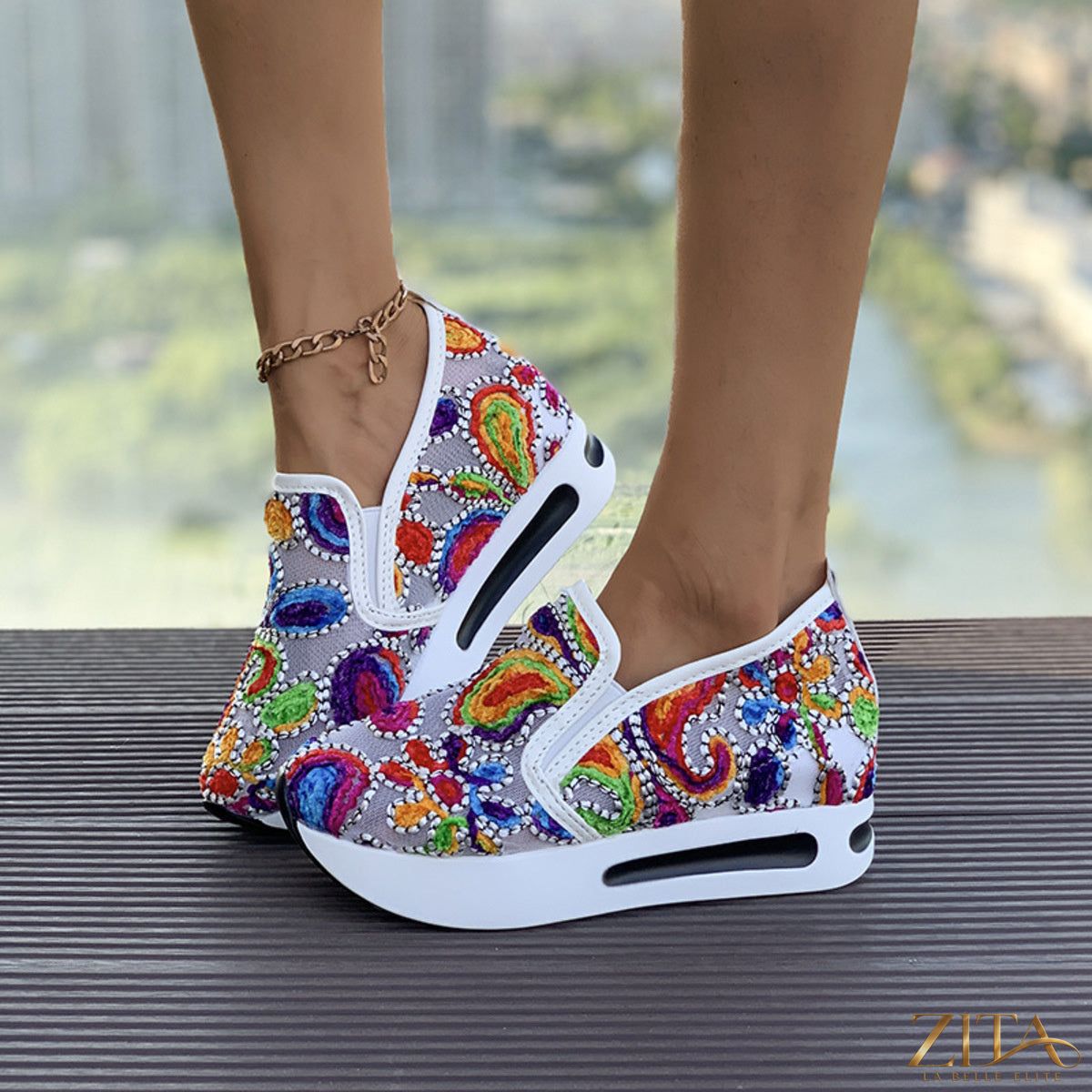 Printed platform round toe sneakers by Zita La Belle Elite, featuring bold design and chunky soles for trendy casual wear.