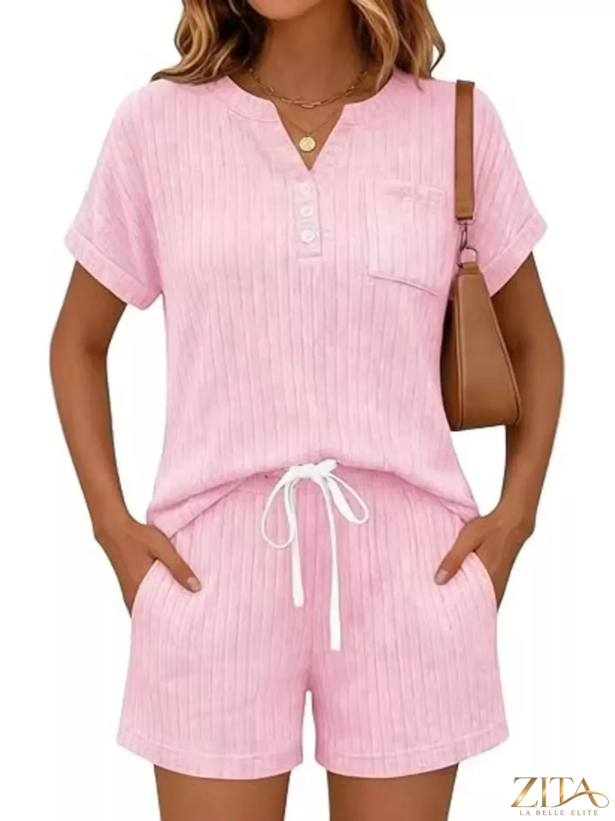 Casual ribbed knit tee and shorts set by Trendsi, featuring a comfortable, relaxed fit in soft, stretchy fabric, perfect for everyday wear.