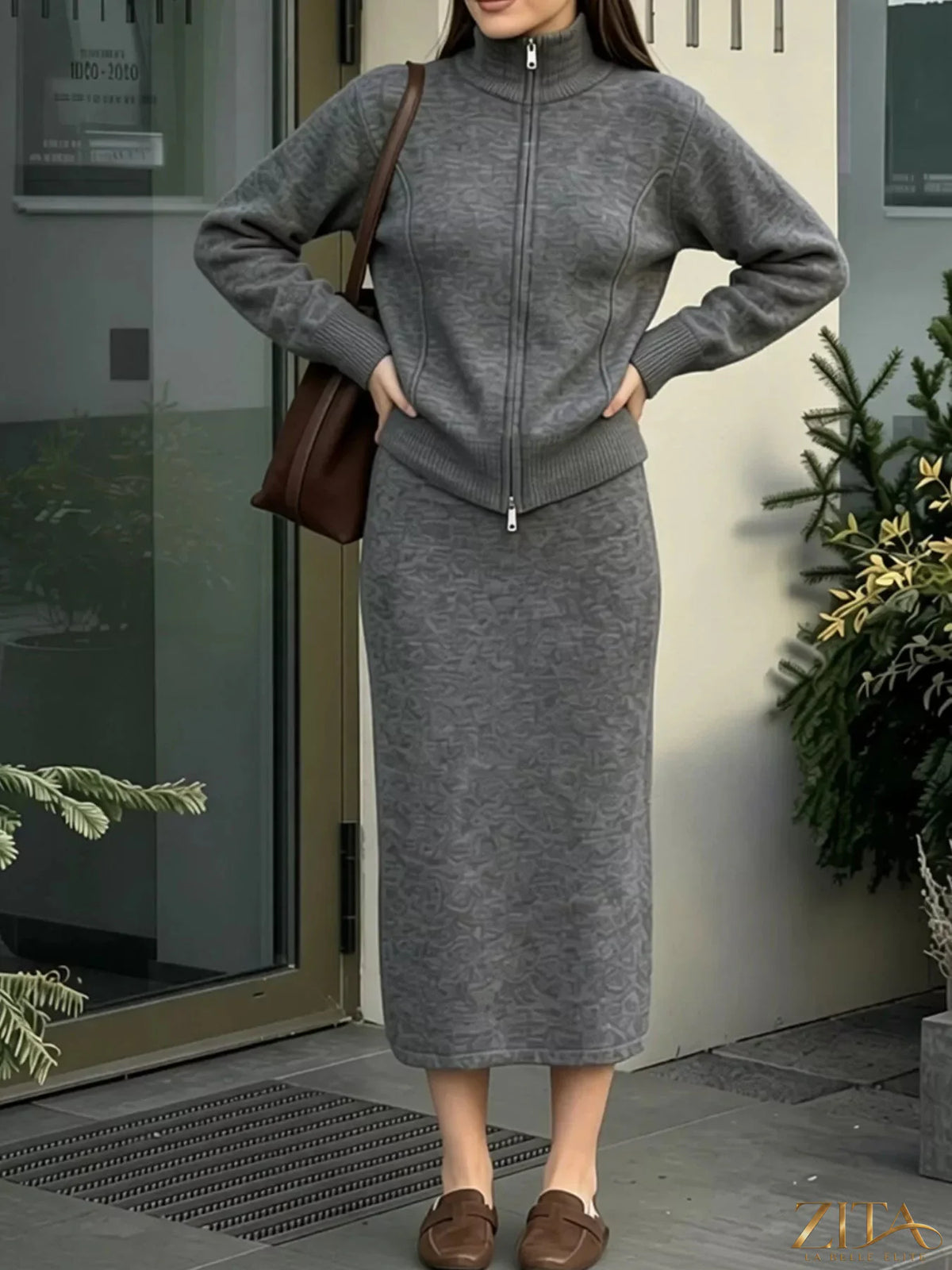Zita La Belle Elite zip-up mock neck cardigan and matching midi skirt sweater set displayed on a model.
