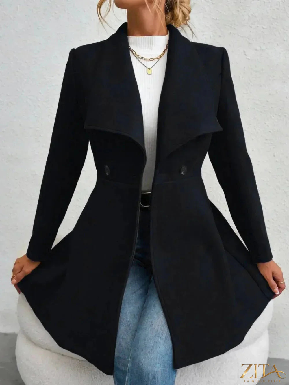 Zita La Belle Elite collared neck button-up long sleeve coat hanging on a rack with a tailored fit and classic design.