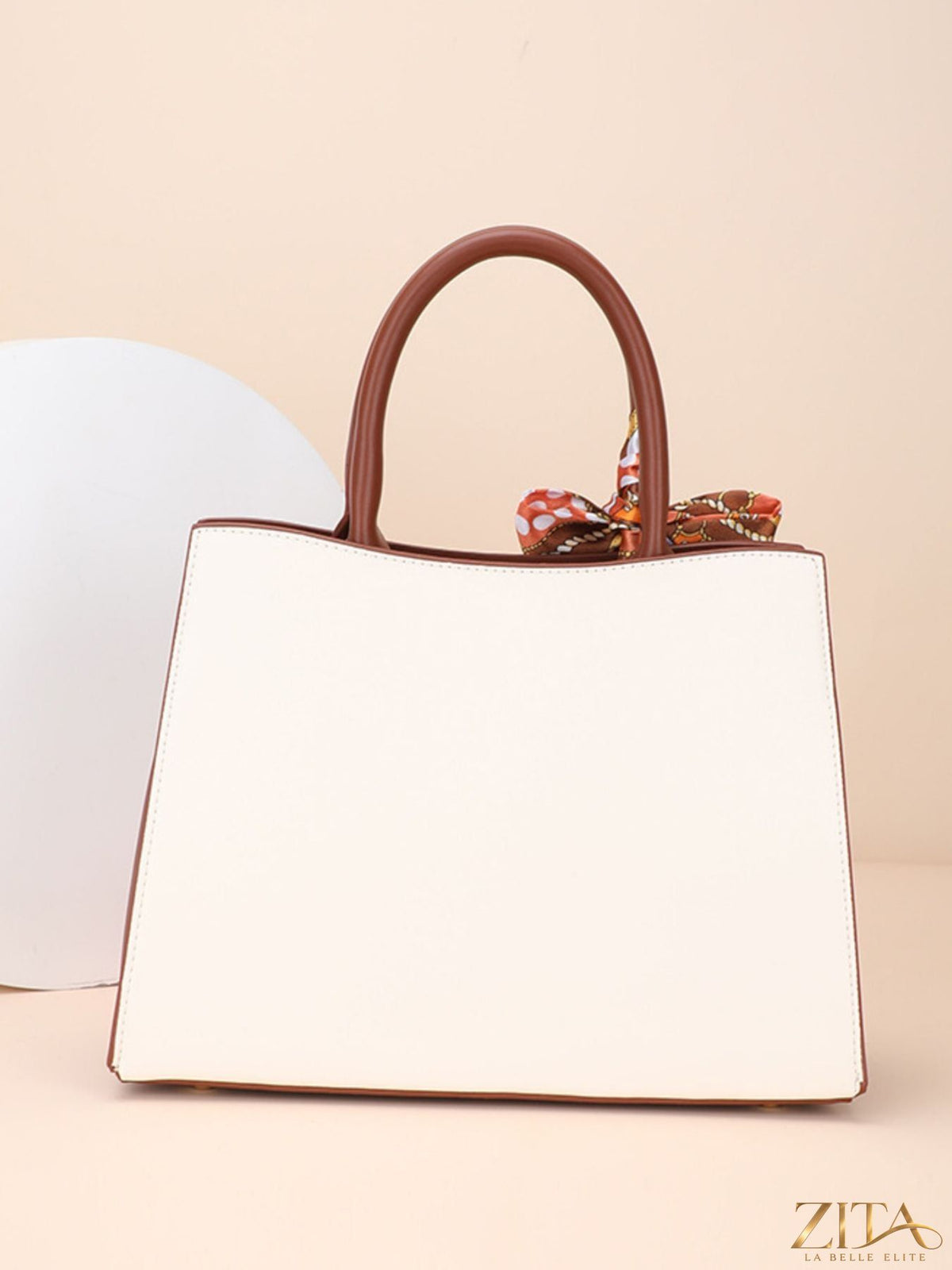 Zita La Belle Elite floral top handle handbag with elegant design and floral pattern, featuring a structured shape and leather handles.