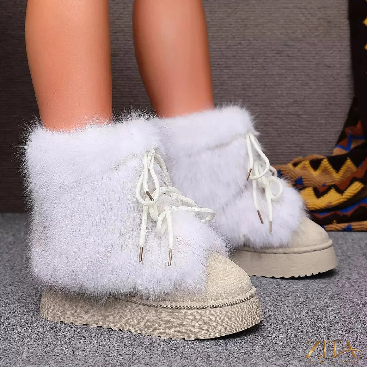 Zita La Belle Elite winter faux fur trimmed lace-up boots showing brown leather with plush fur accents and sturdy soles.