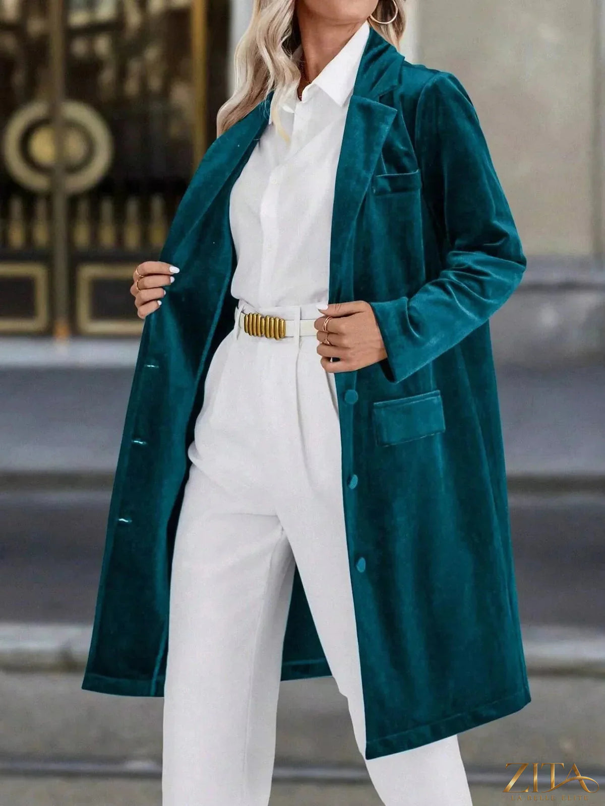 Zita La Belle Elite longline coat with lapel collar, long sleeves, and tailored fit, shown in a sleek black fabric.