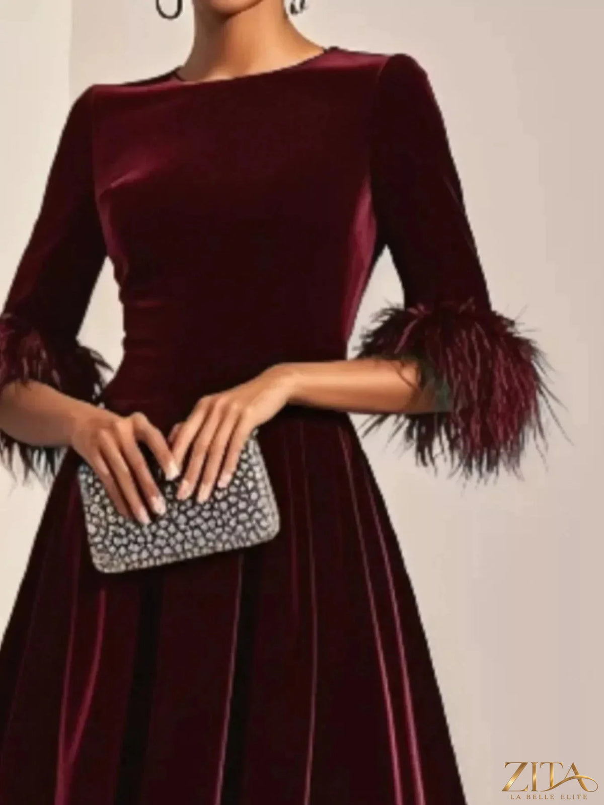 Velvet midi dress by Zita La Belle Elite featuring feather cuffs, elegant design, and rich fabric for a sophisticated look.