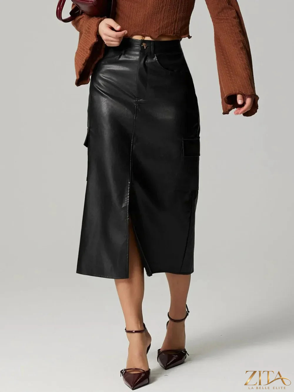 Trendsi slit midi skirt with pockets, featuring a flowing design and side slit, perfect for casual or dressy occasions.