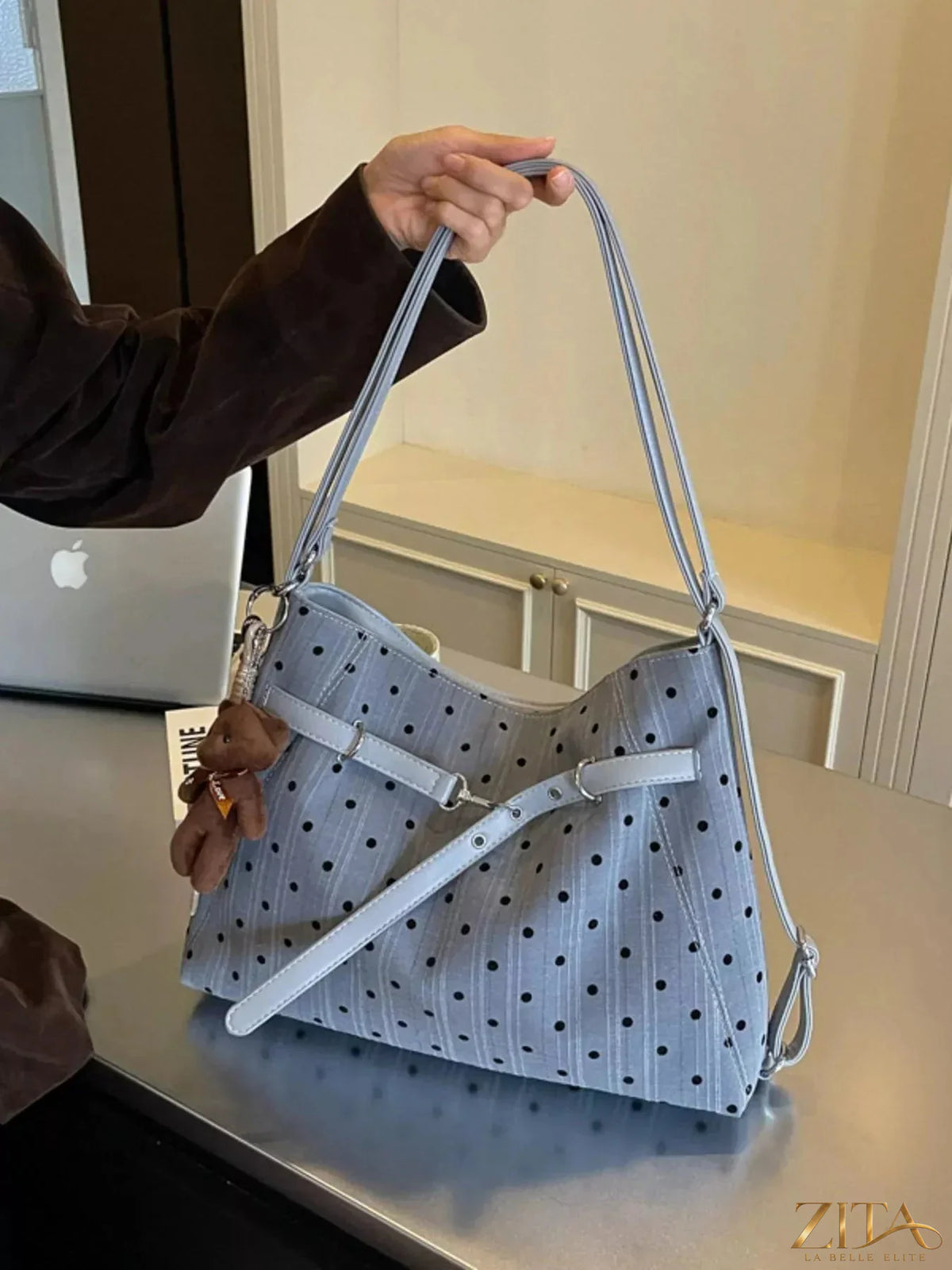 Zita La Belle Elite polka dot shoulder bag with black and white pattern, featuring a sleek strap and compact design.