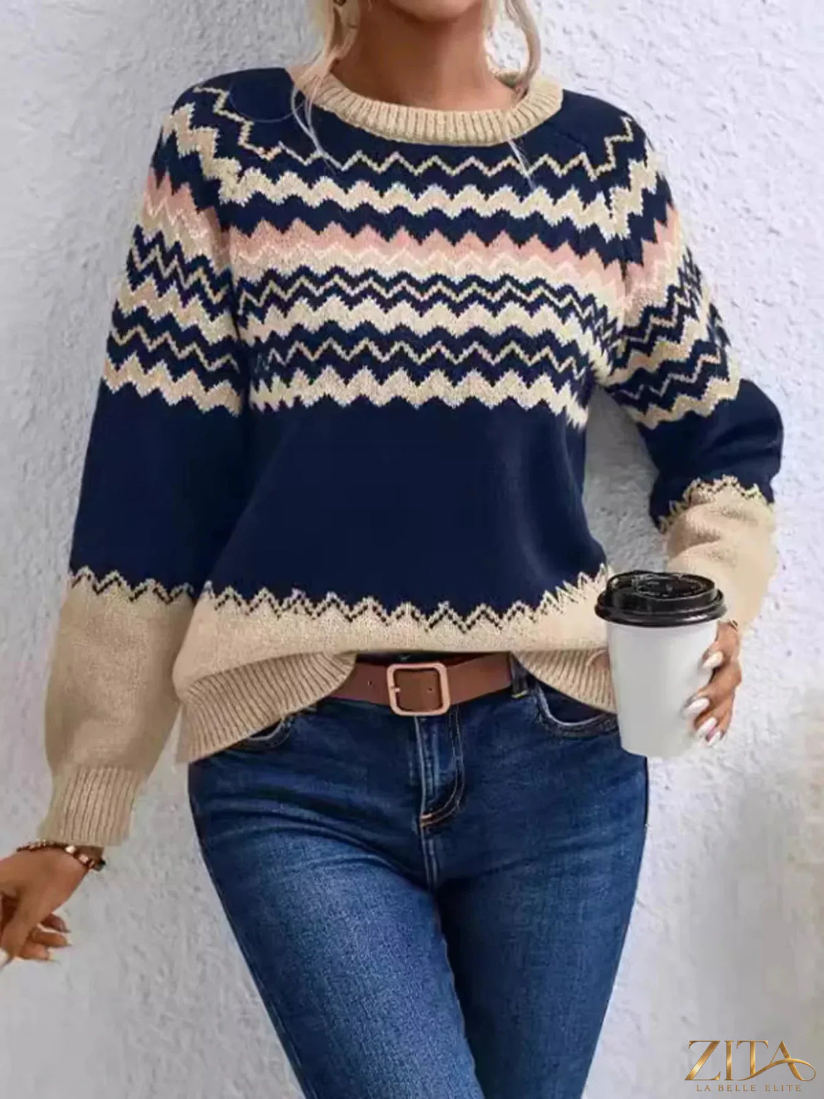 Trendsi geometric pattern knitted sweater featuring a colorful, modern design with a cozy, textured knit fabric.