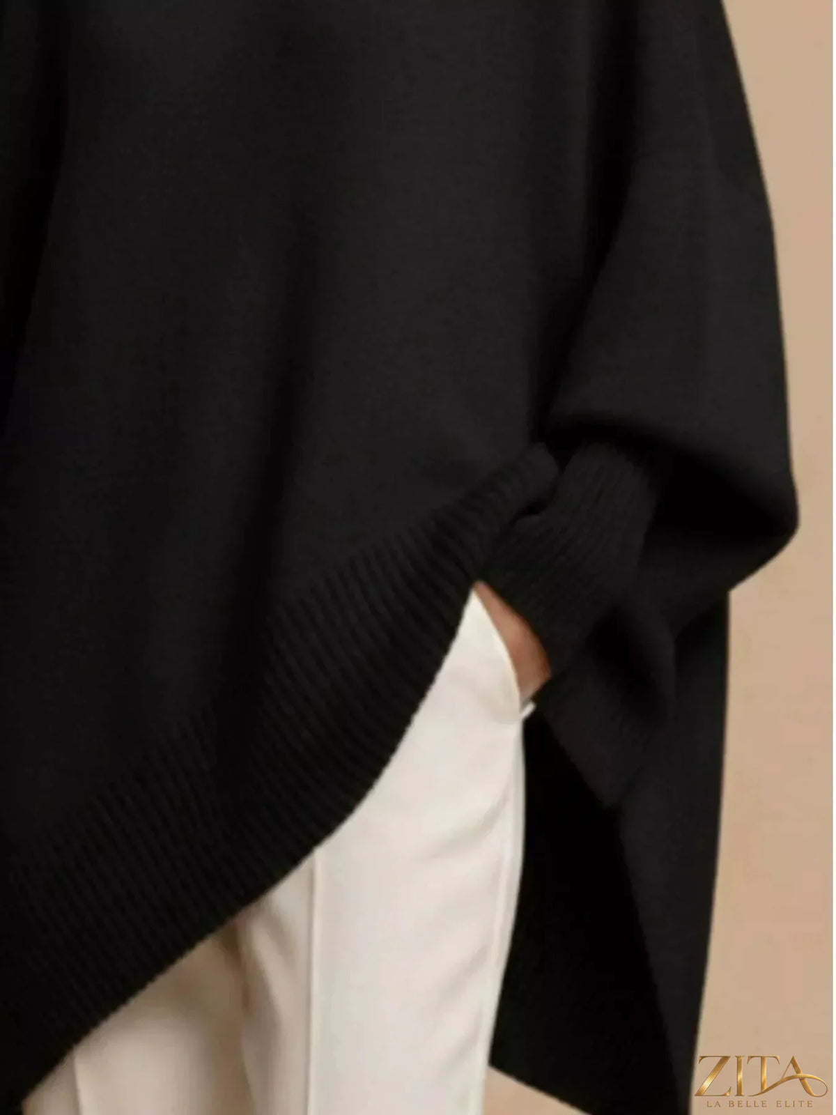 Oversized dropped shoulder sweater by Trendsi featuring a relaxed fit, soft knit fabric, and a cozy, casual style.