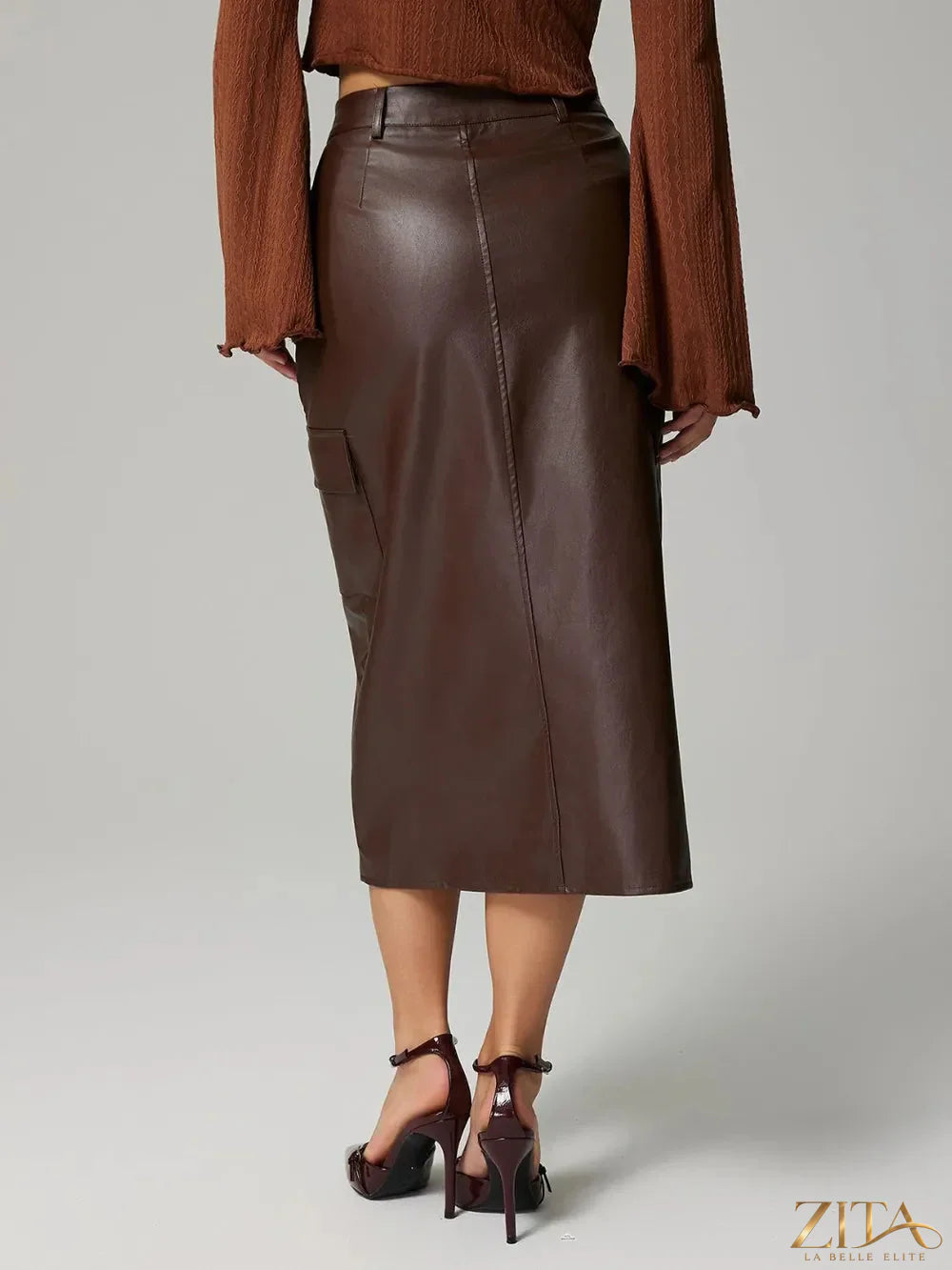 Trendsi slit midi skirt with pockets, featuring a stylish slit design and functional pockets, made from lightweight fabric.