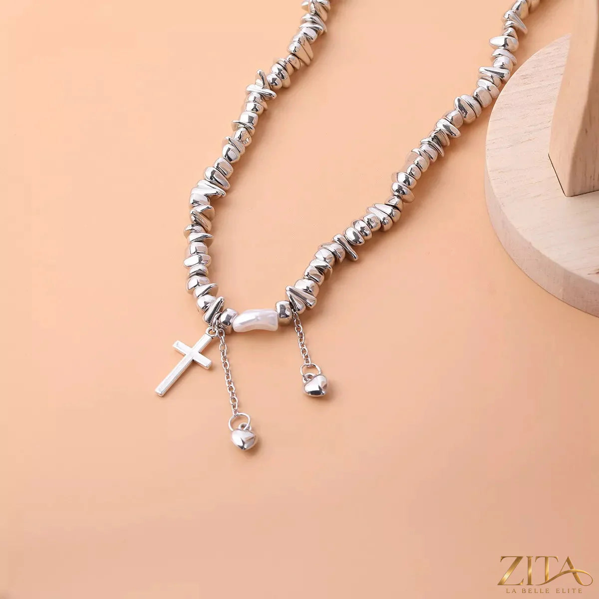 Zita La Belle Elite chunky chain cross pendant necklace with bold metal links and a prominent cross charm, close-up view.