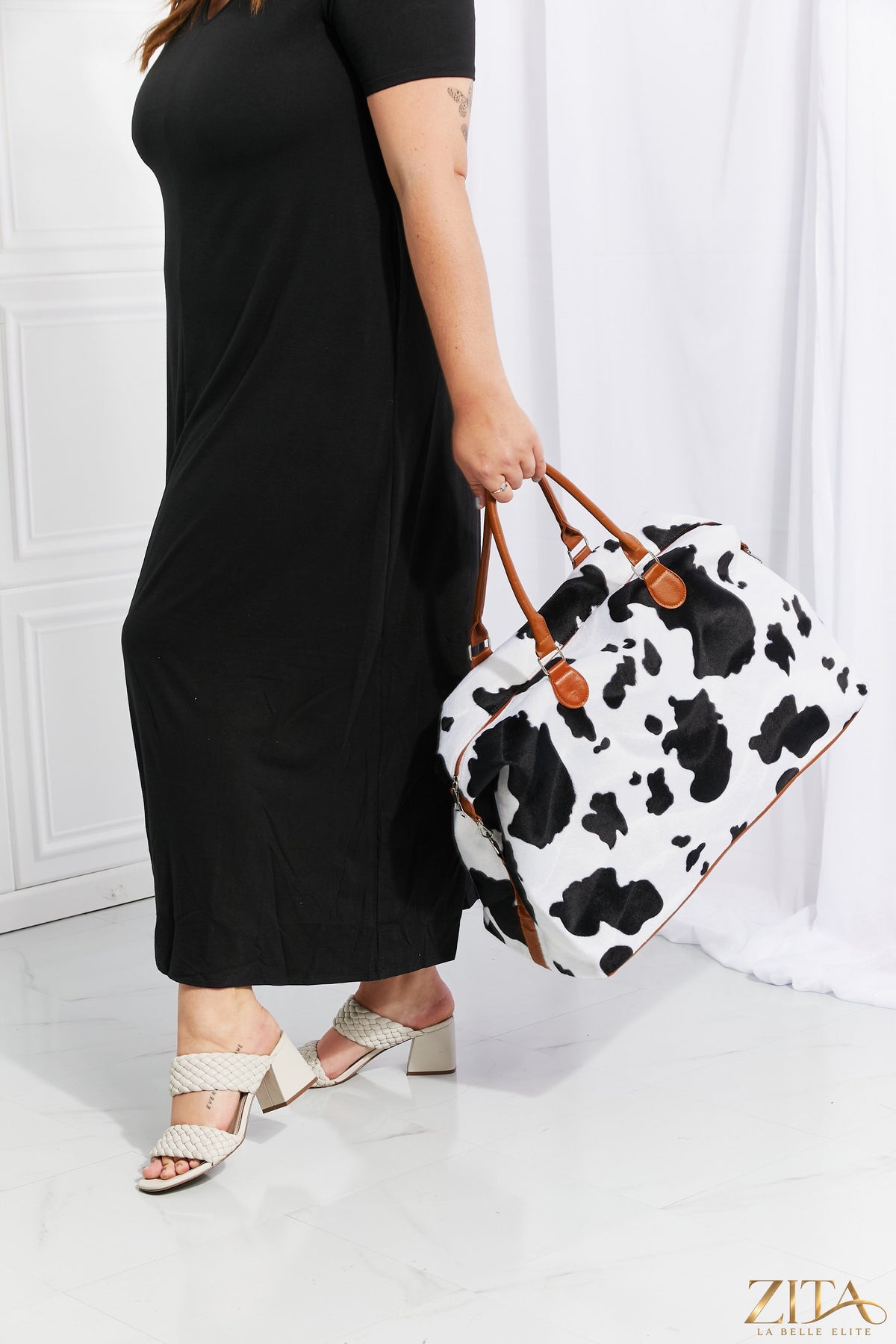 Animal print plush weekender bag by Zita La Belle Elite with soft fabric, stylish leopard pattern, and spacious design for travel or weekend trips.
