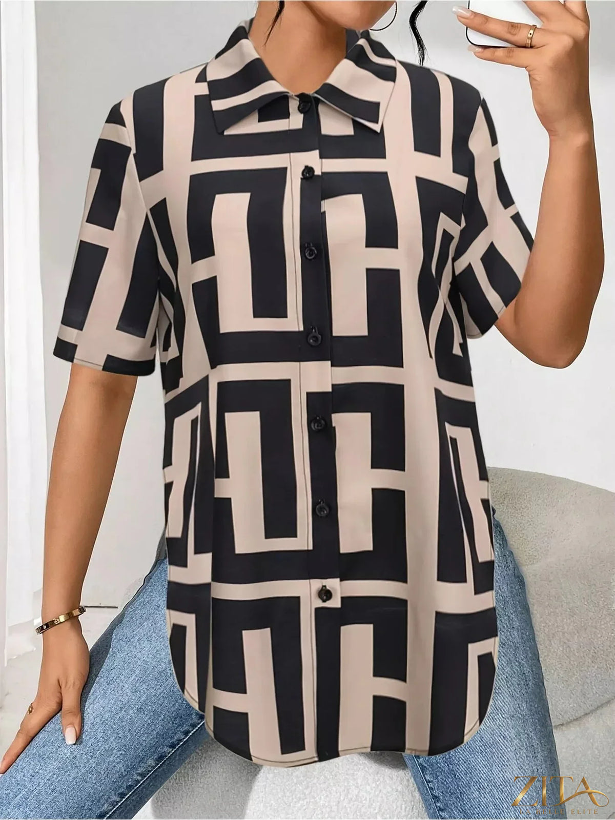 Zita La Belle Elite geometric print button-down short sleeve shirt showcasing bold geometric patterns and classic collar.