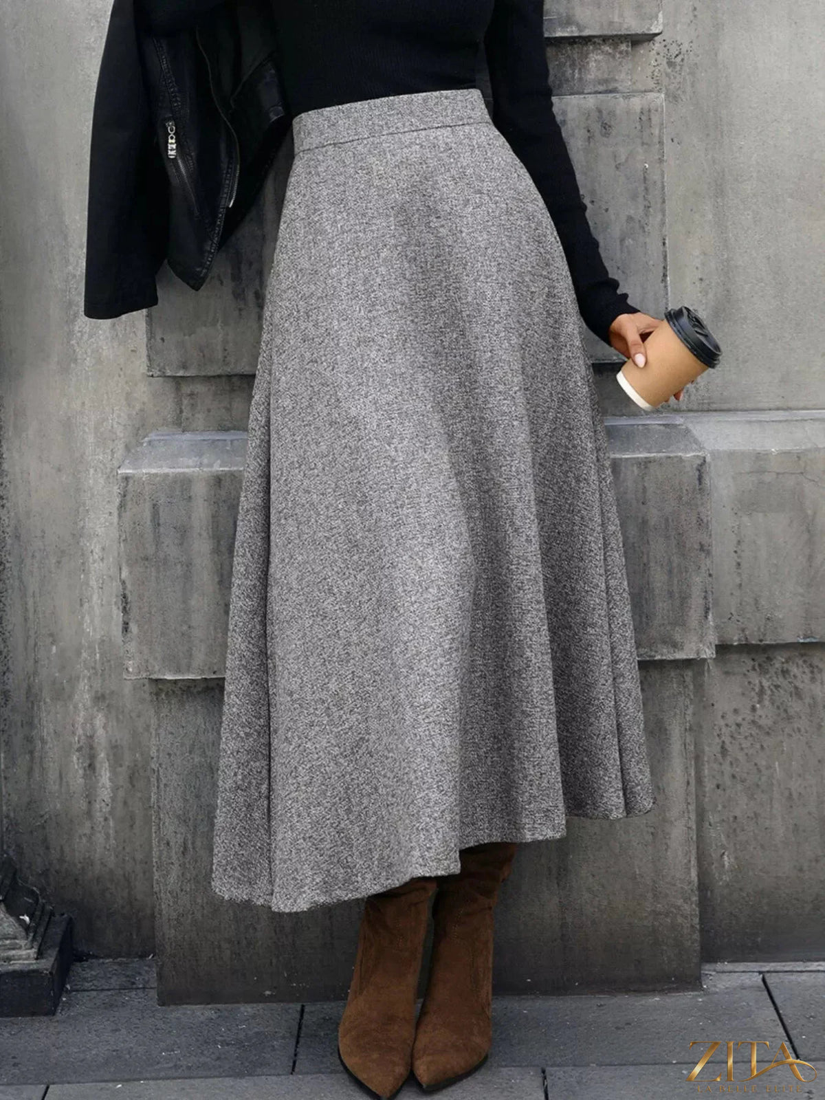 A-line midi skirt from Trendsi featuring a flowy design, high waist, and knee-length style in a versatile fabric.