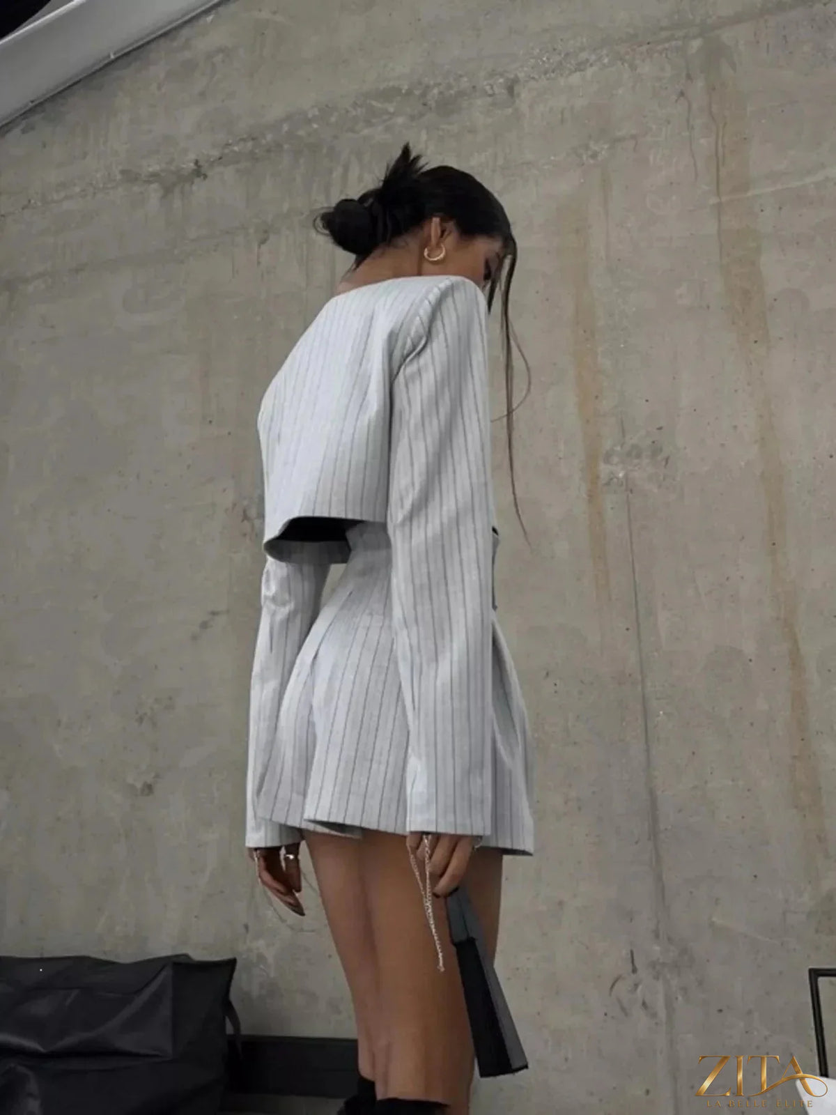 Zita La Belle Elite pinstripe cropped blazer and pleated shorts set, featuring a tailored blazer and matching shorts with pleats.