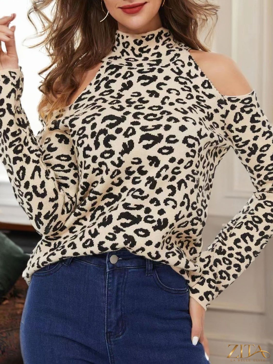 Leopard print cold-shoulder sweater from Zita La Belle Elite featuring long sleeves and stylish cut-out shoulders.