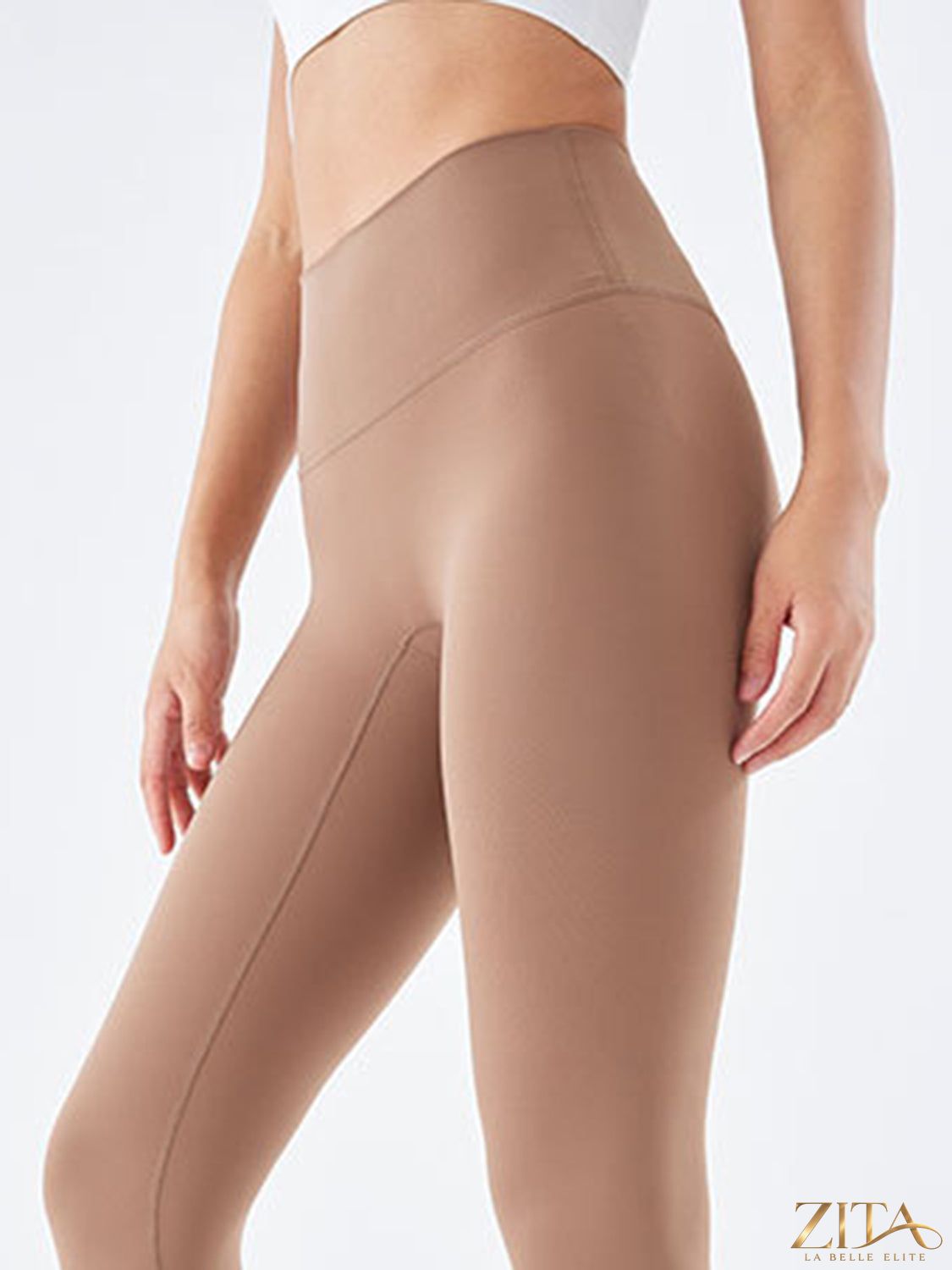 Black wide waistband sports leggings by Trendsi, shown on a model, featuring a high-rise fit and stretchy athletic fabric.