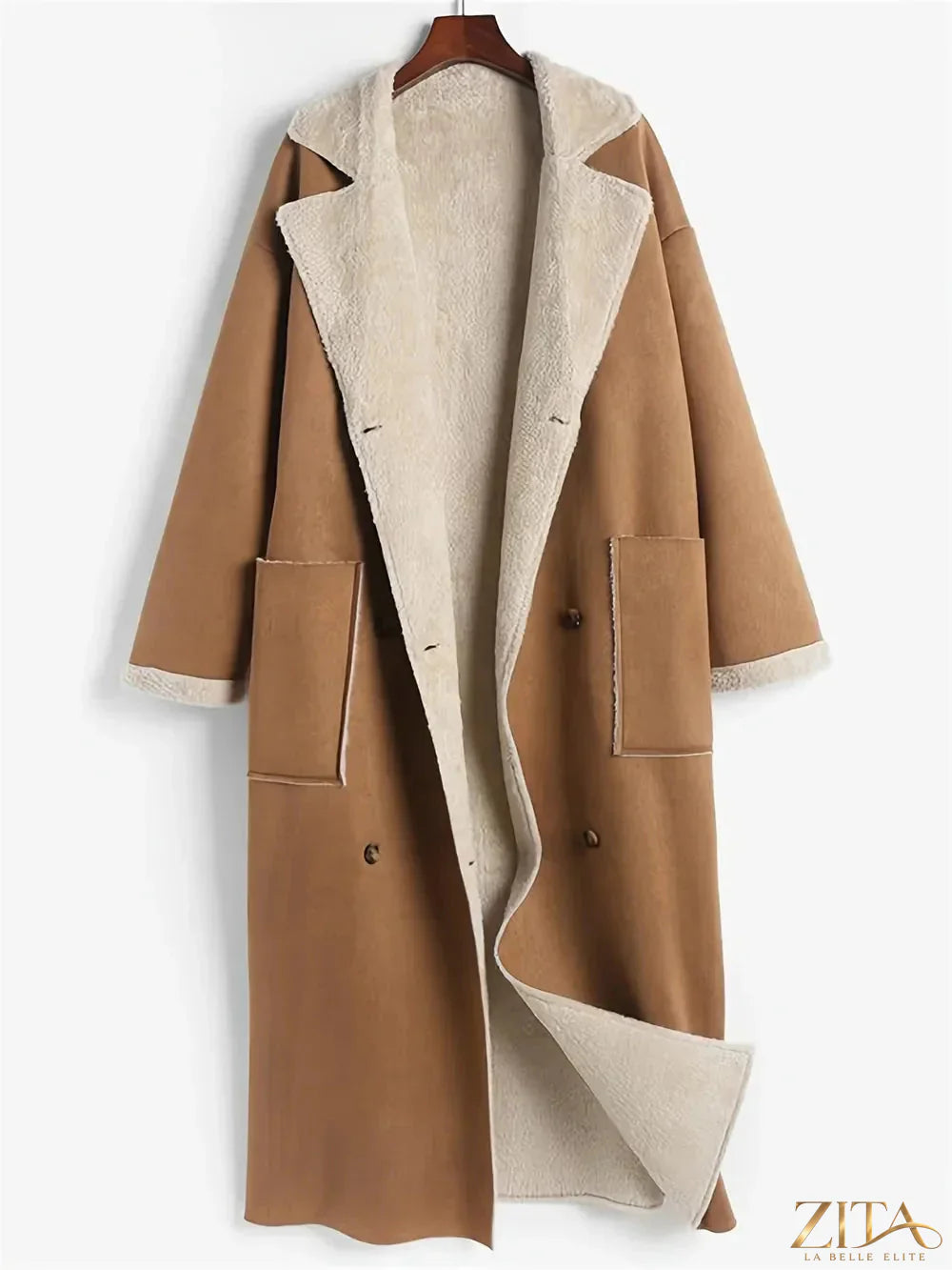 Plus size Zita La Belle Elite drop shoulder sherpa longline coat hanging on a rack, showcasing its cozy, oversized design.