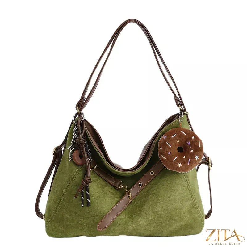 Adjustable strap handbag by Zita La Belle Elite featuring a decorative charm and sleek design, perfect for stylish everyday use.