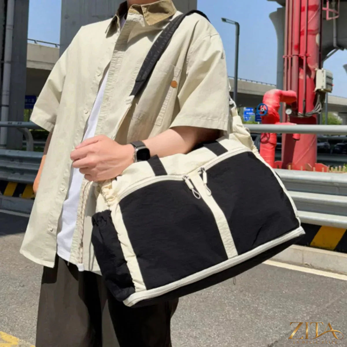 Color block travel bag by Zita La Belle Elite with vibrant sections, sturdy handles, and spacious design for travel essentials.