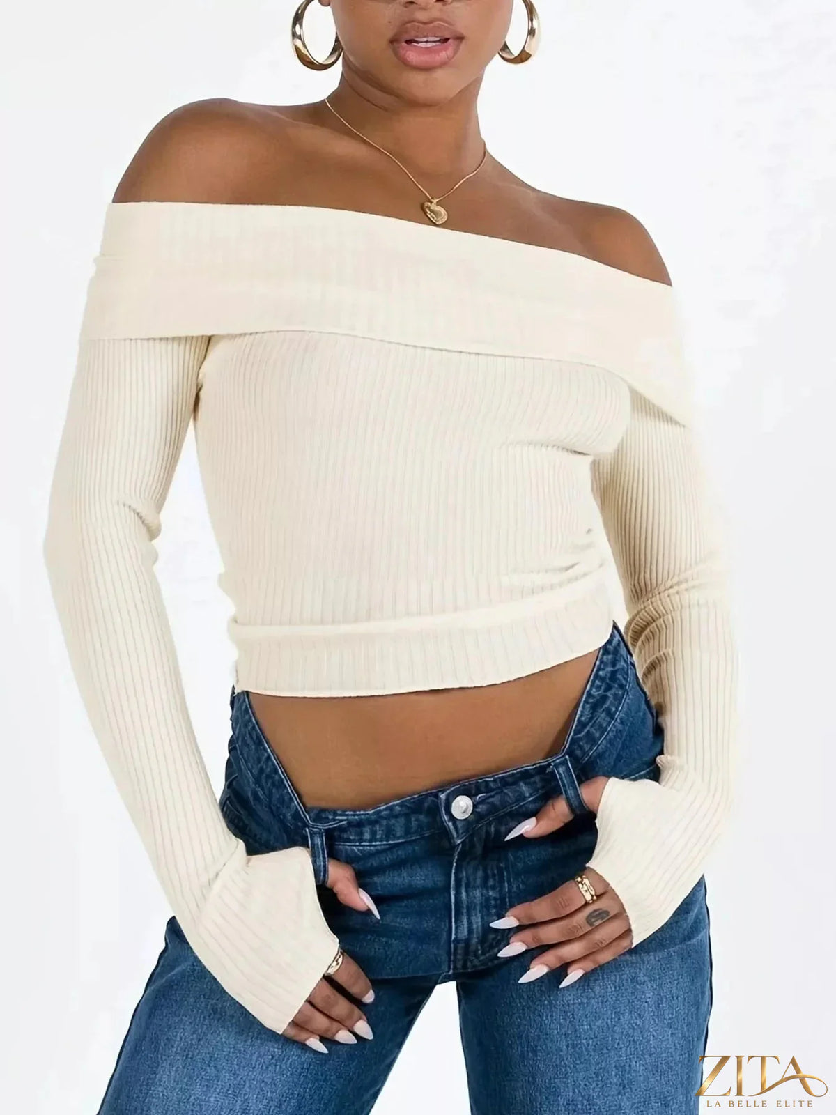 Off-shoulder ribbed knit sweater by Trendsi, featuring a cozy, fitted design with long sleeves and a stylish off-shoulder neckline.