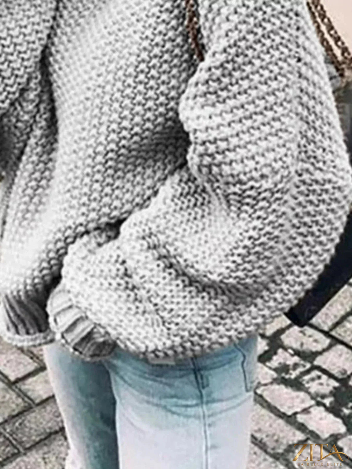 Zita La Belle Elite chunky knit turtleneck sweater in soft beige with a cozy, oversized fit and ribbed turtleneck collar.