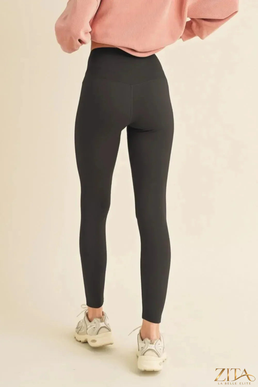 Yelete fleece-lined high waisted leggings in black, showcasing their cozy, full-size fit and comfortable high-rise waistband.
