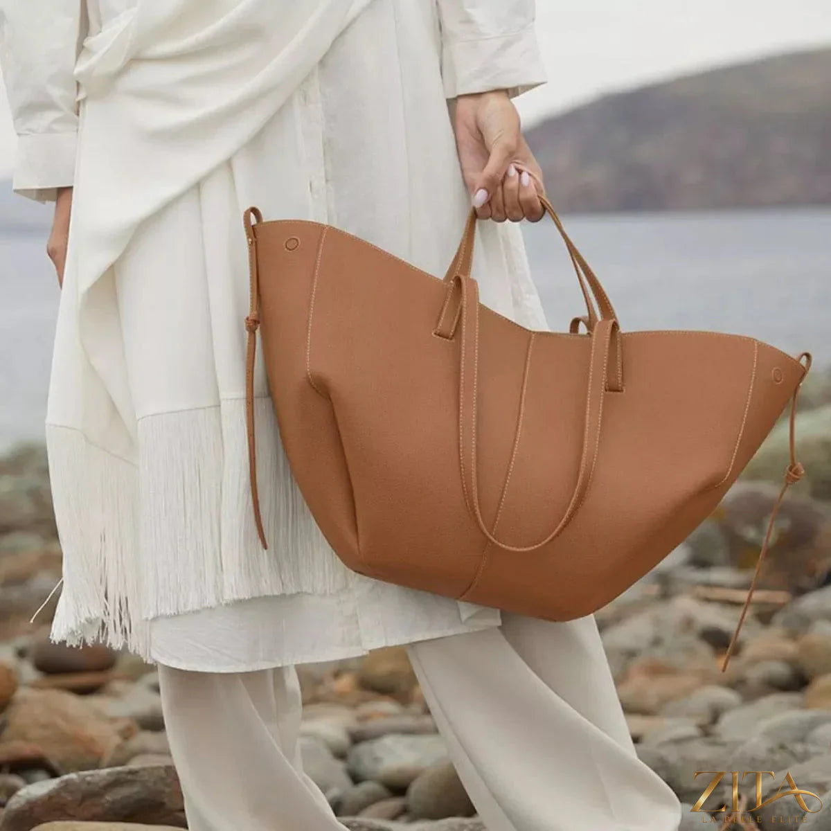 Trendsi PU leather tote bag with spacious interior, sturdy handles, and sleek design, perfect for everyday use.