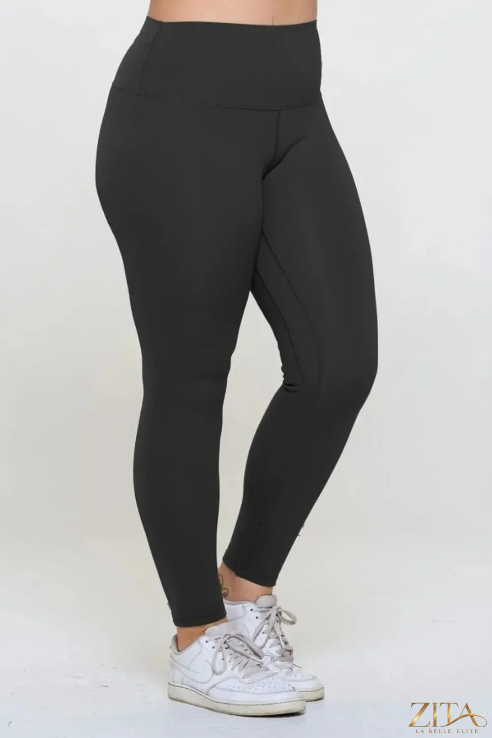 Black Yelete full size fleece-lined high-waisted leggings with stretchy fabric and cozy fleece interior, perfect for cold weather.