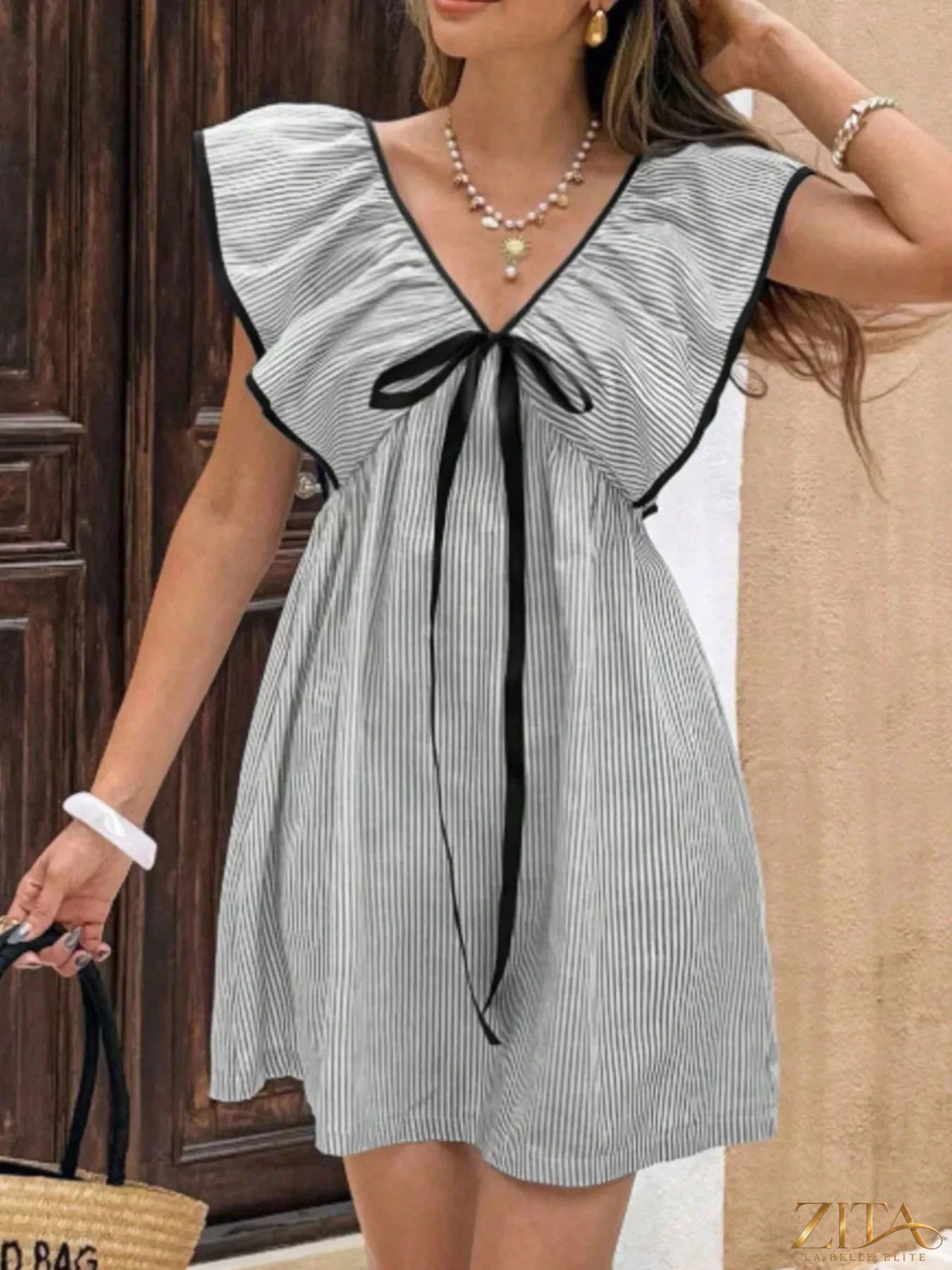 Striped ruffle sleeve mini dress from Trendsi featuring a fitted silhouette and playful ruffle accents on the sleeves.