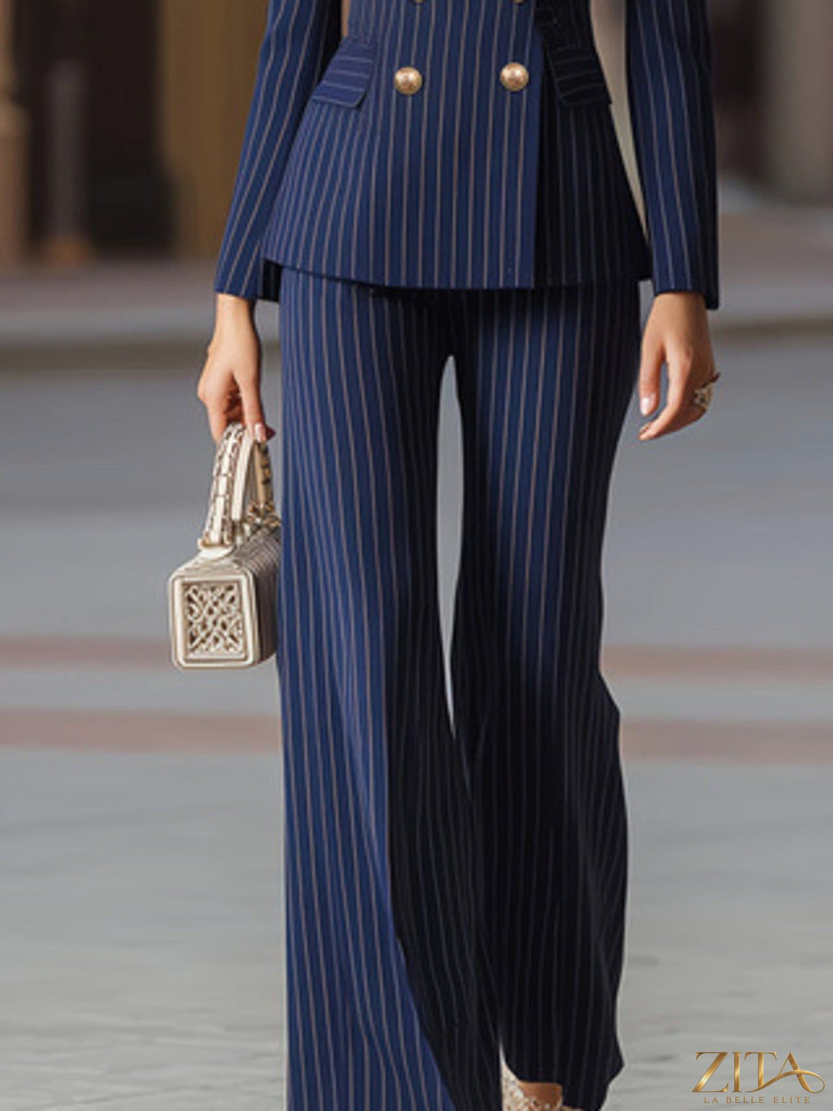 Zita La Belle Elite striped double-breasted blazer and wide-leg pants set featuring bold pattern and tailored fit.