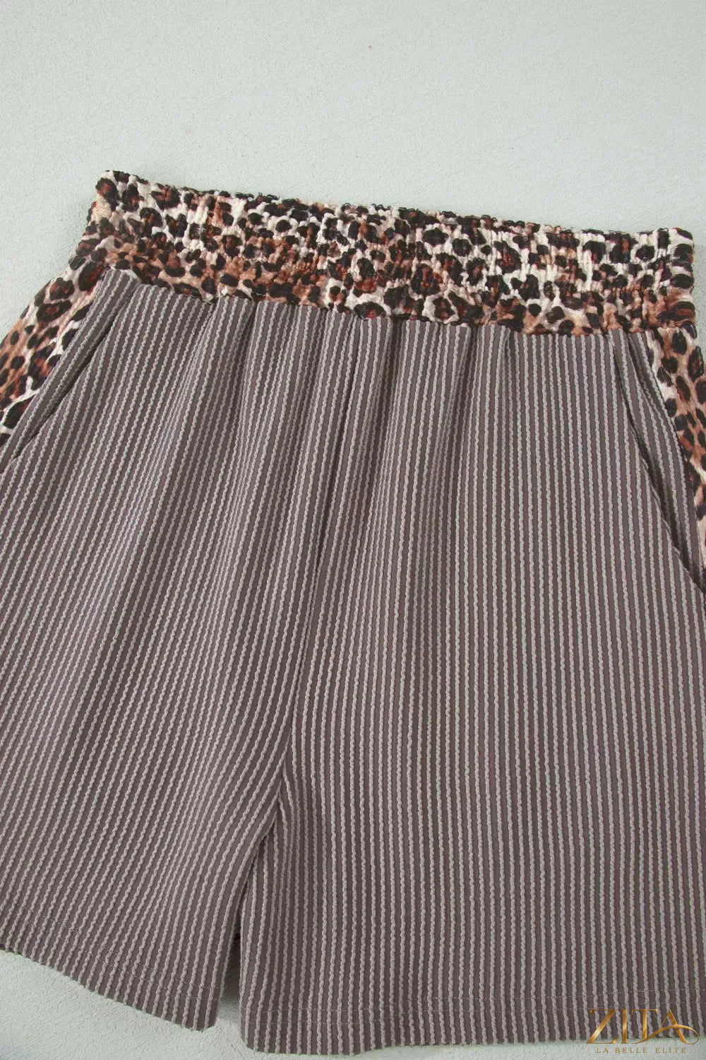 Leopard trim ribbed knit tee and shorts set by Trendsi, featuring a matching two-piece design with leopard accents.