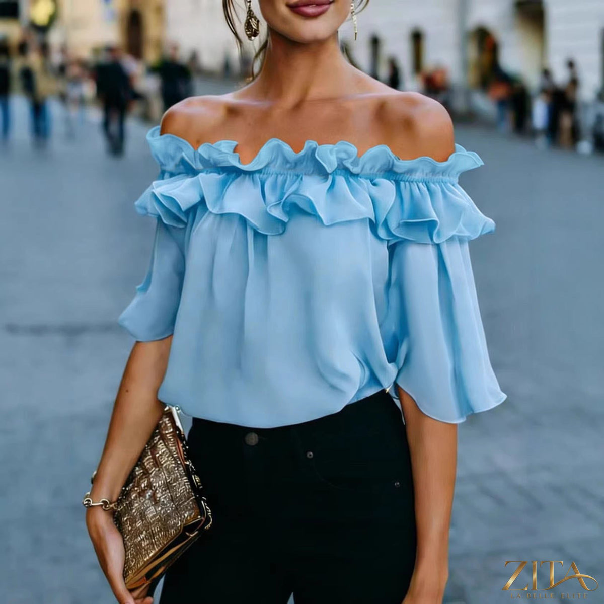 Women's loose-fit minimalist short-sleeve casual shirt by Zita La Belle Elite, shown laid flat with a relaxed fit and simple design.