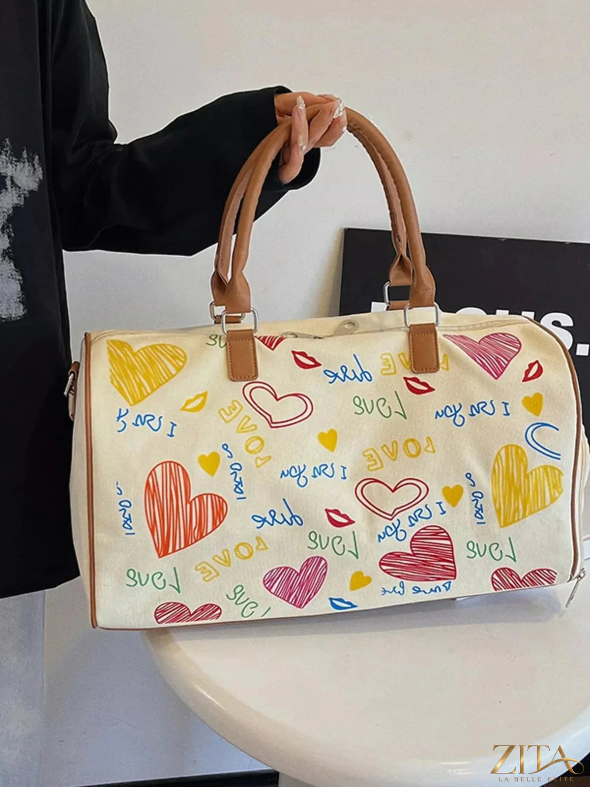 Zita La Belle Elite printed duffel bag with adjustable strap, featuring a stylish design and spacious interior for travel or gym use.