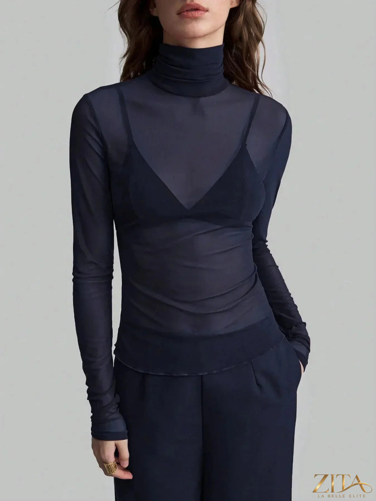 Zita La Belle Elite turtleneck long sleeve top in a fitted style, featuring a smooth fabric and classic neckline.