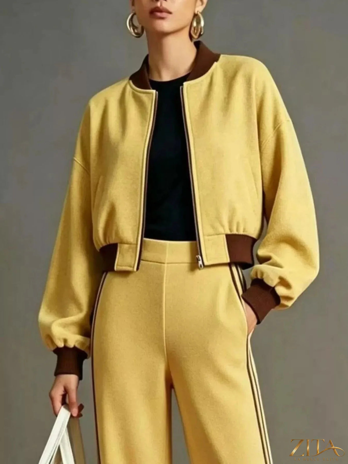 Contrast ribbed jacket and wide-leg pants tracksuit set by Zita La Belle Elite, featuring a stylish, coordinated athletic wear look.