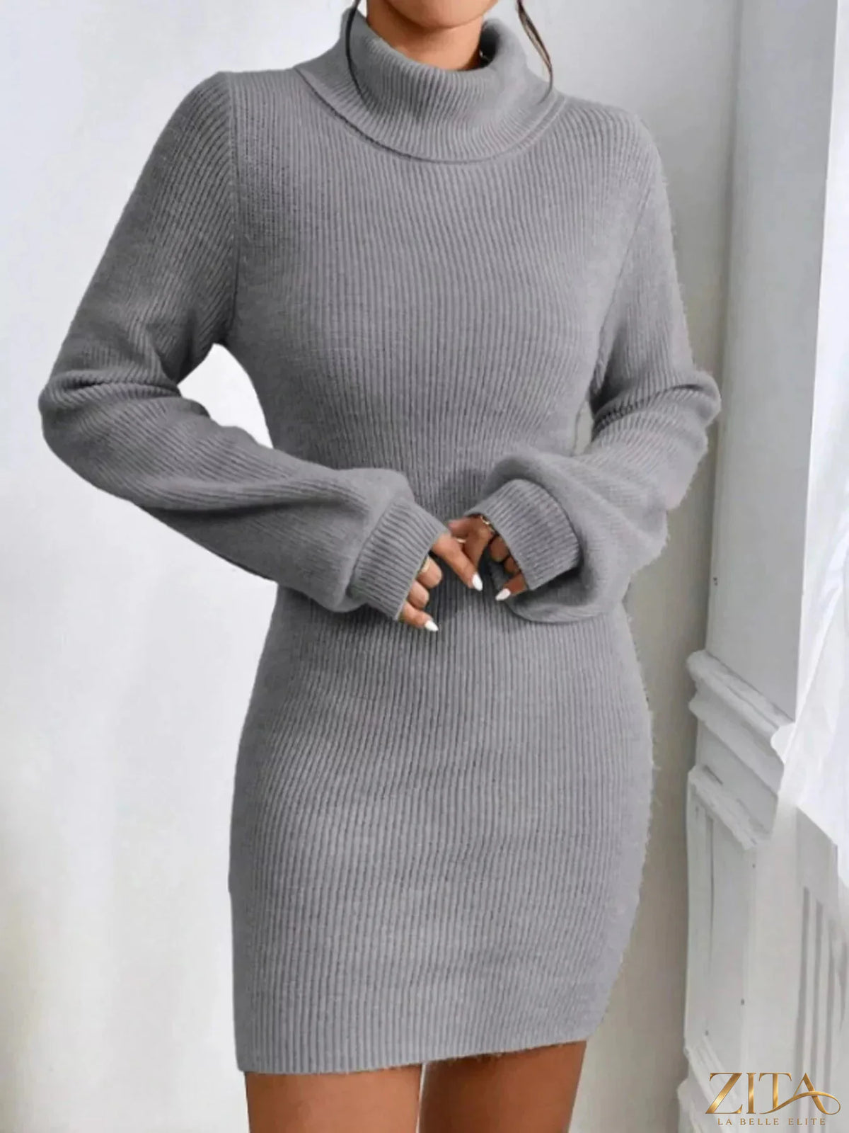 Ribbed knit turtleneck sweater dress by Trendsi, featuring a fitted silhouette and cozy ribbed texture, displayed on a mannequin.