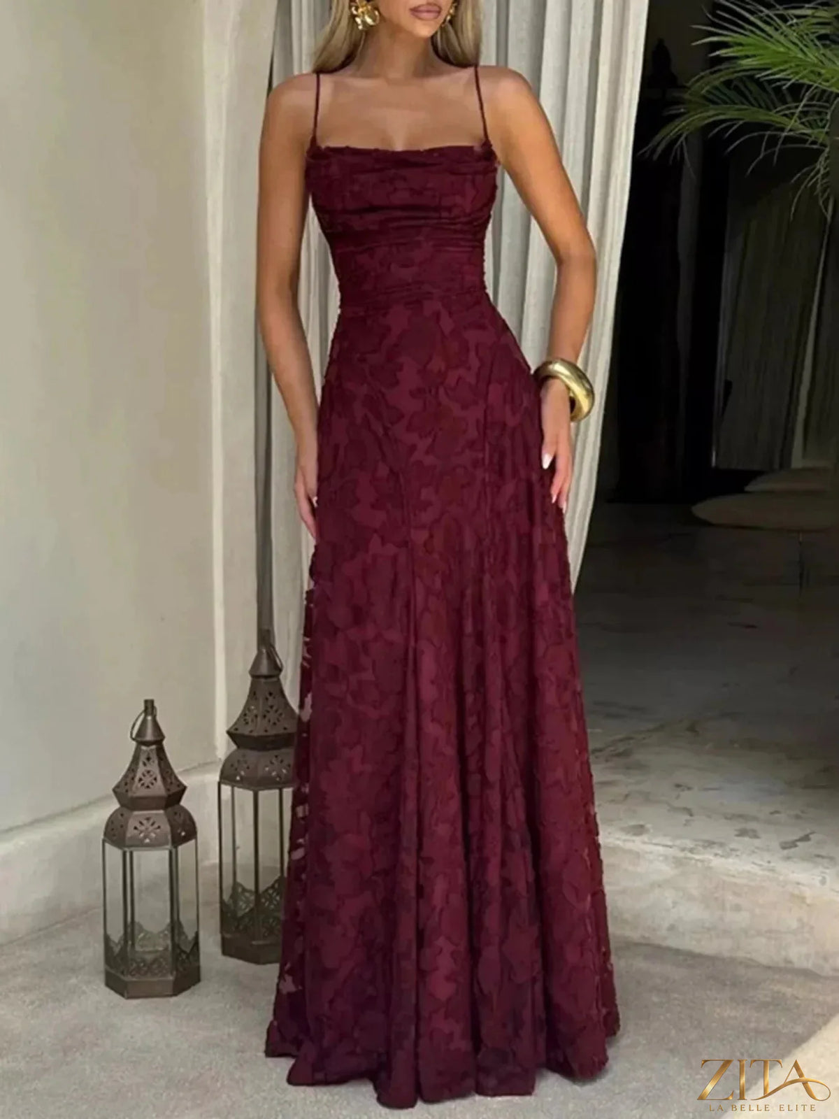 Zita La Belle Elite lace spaghetti strap maxi dress with flowing silhouette and intricate lace detailing on a model.