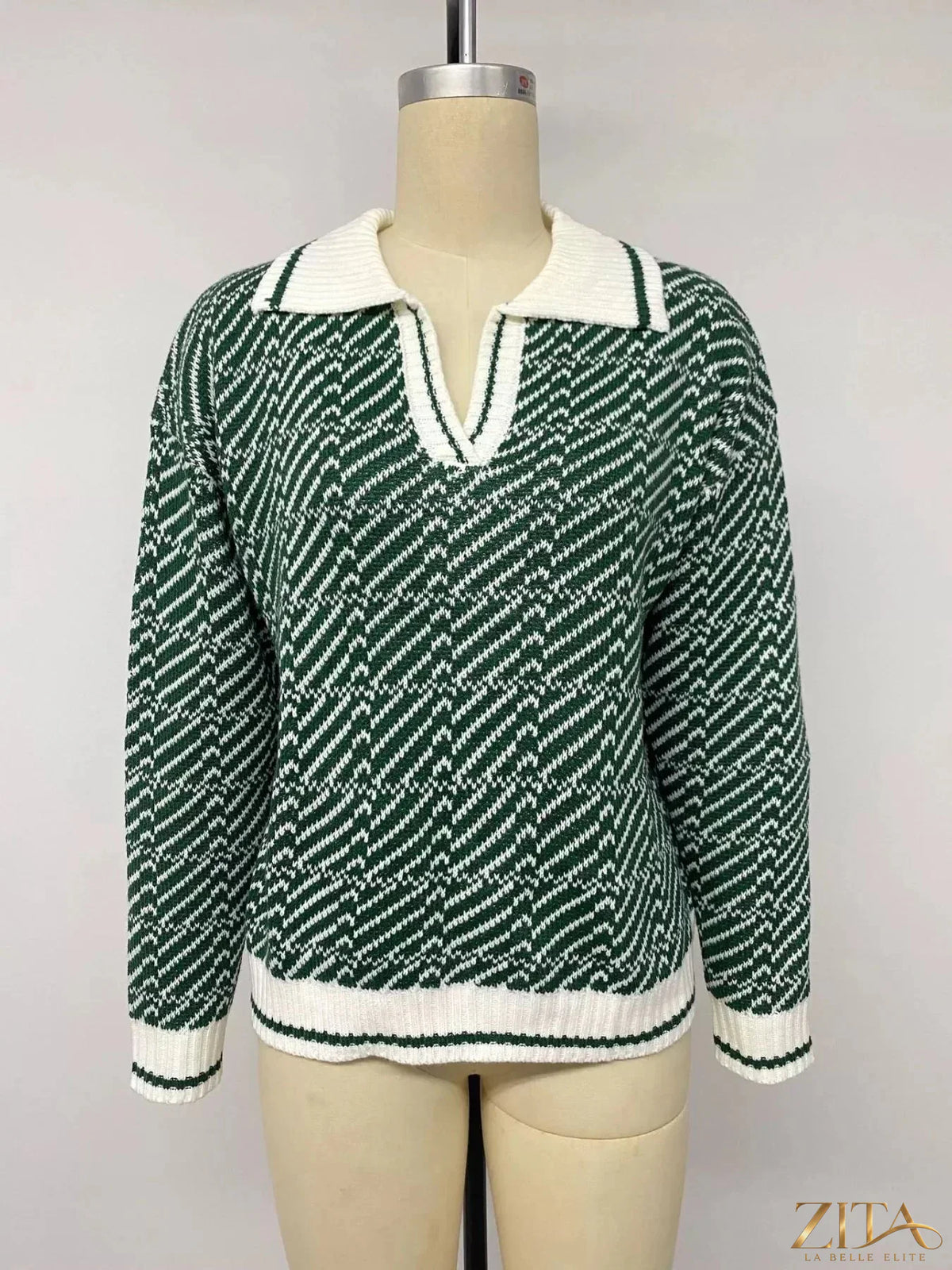 Zita La Belle Elite geometric patterned collared sweater featuring bold designs and a classic collar, displayed on a neutral background.