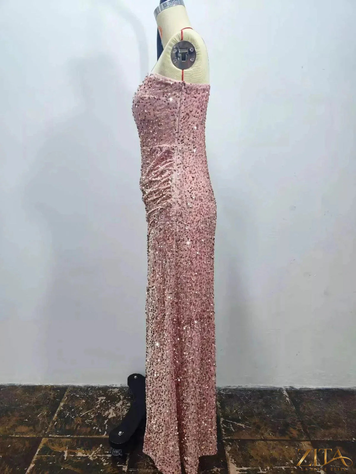 Elegant one-shoulder ruched sequin evening dress with high slit by Zita La Belle Elite, featuring shimmering sequins and a stylish silhouette.