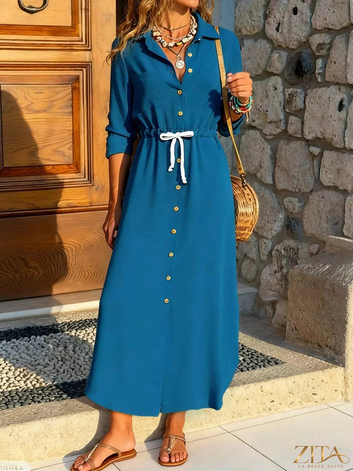 Zita La Belle Elite button-down long sleeve dress with a fitted waist and classic collar, shown on a hanger.