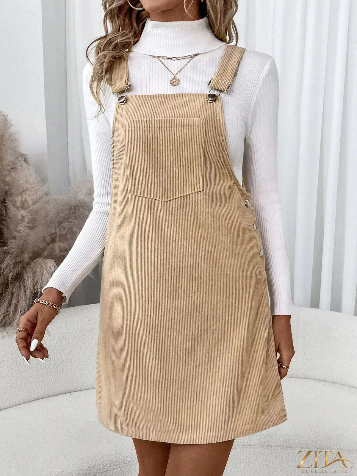 Zita La Belle Elite casual corduroy overall dress hanging on a wooden hanger, showcasing front view and soft brown fabric.