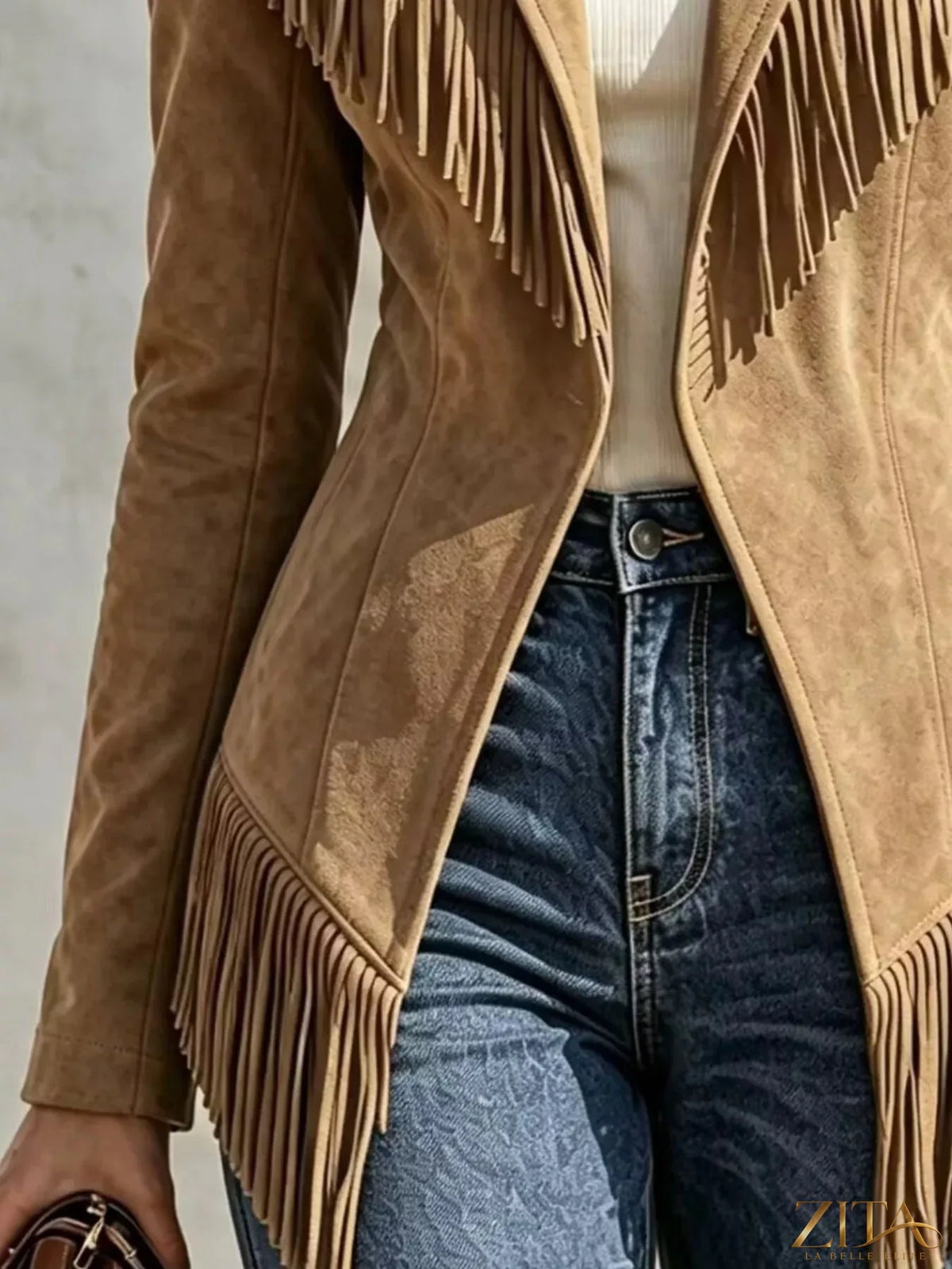 Western-inspired fringed open front jacket from Trendsi, showing its tan fabric with fringe details and relaxed fit.