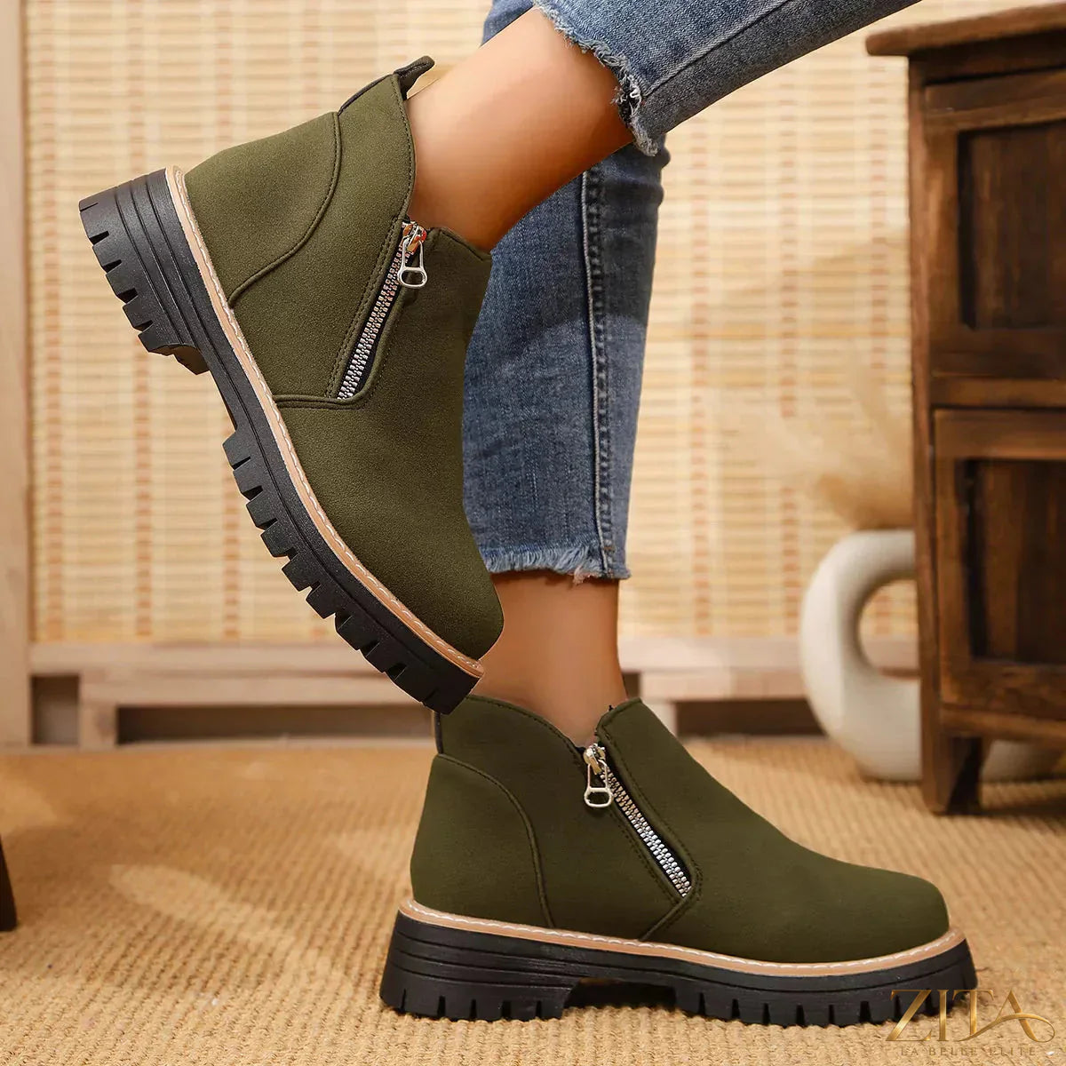 Zita La Belle Elite ankle boots with zipper accent, featuring sleek black leather and stylish design.