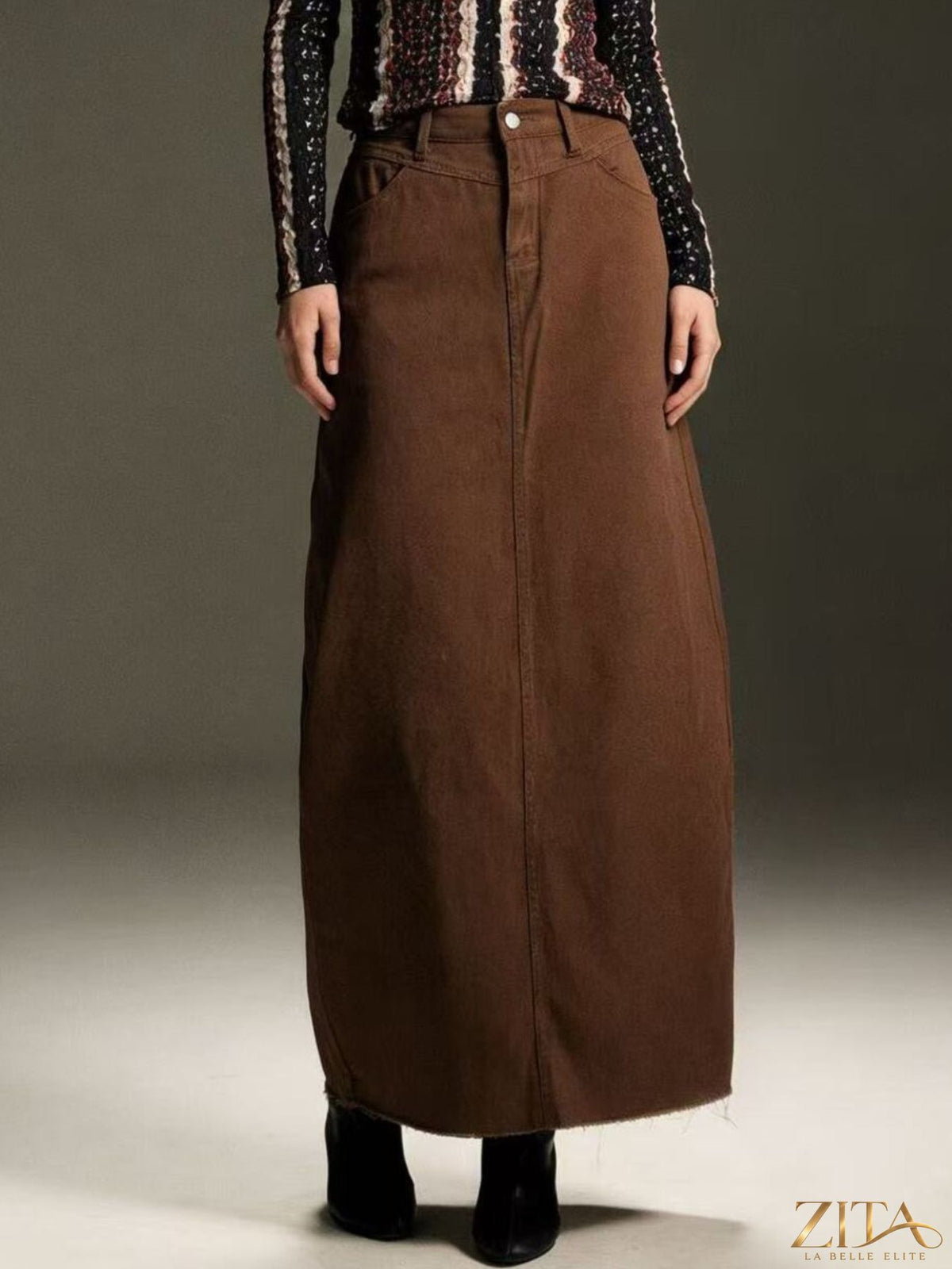 Raw hem maxi denim skirt by Zita La Belle Elite, featuring a flowing design and classic denim fabric with a raw hem detail.