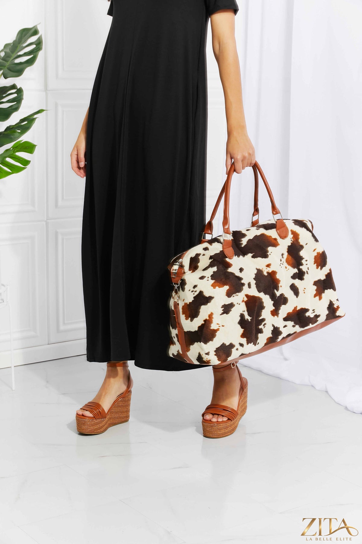 Zita La Belle Elite animal print plush weekender bag with zipper closure and sturdy handles, ideal for travel and weekend trips.
