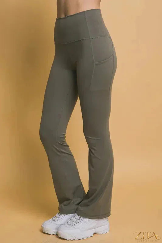 Love Tree high waist flare active leggings by Trendsi with side pockets, shown in black fabric, designed for comfort and style.