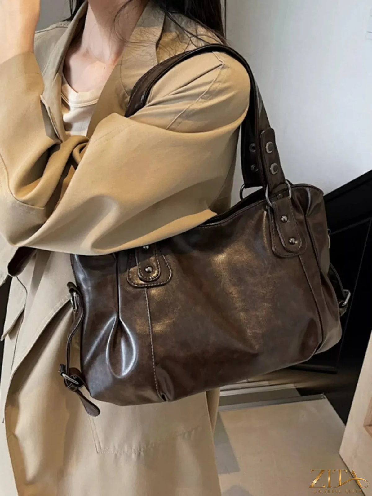 Vintage style leather handbag by Trendsi featuring a classic design with sturdy handles and detailed stitching.